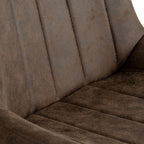 Close-up view of the vertical channel-stitched backrest in dark coffee faux leather on the Malmo swivel chair