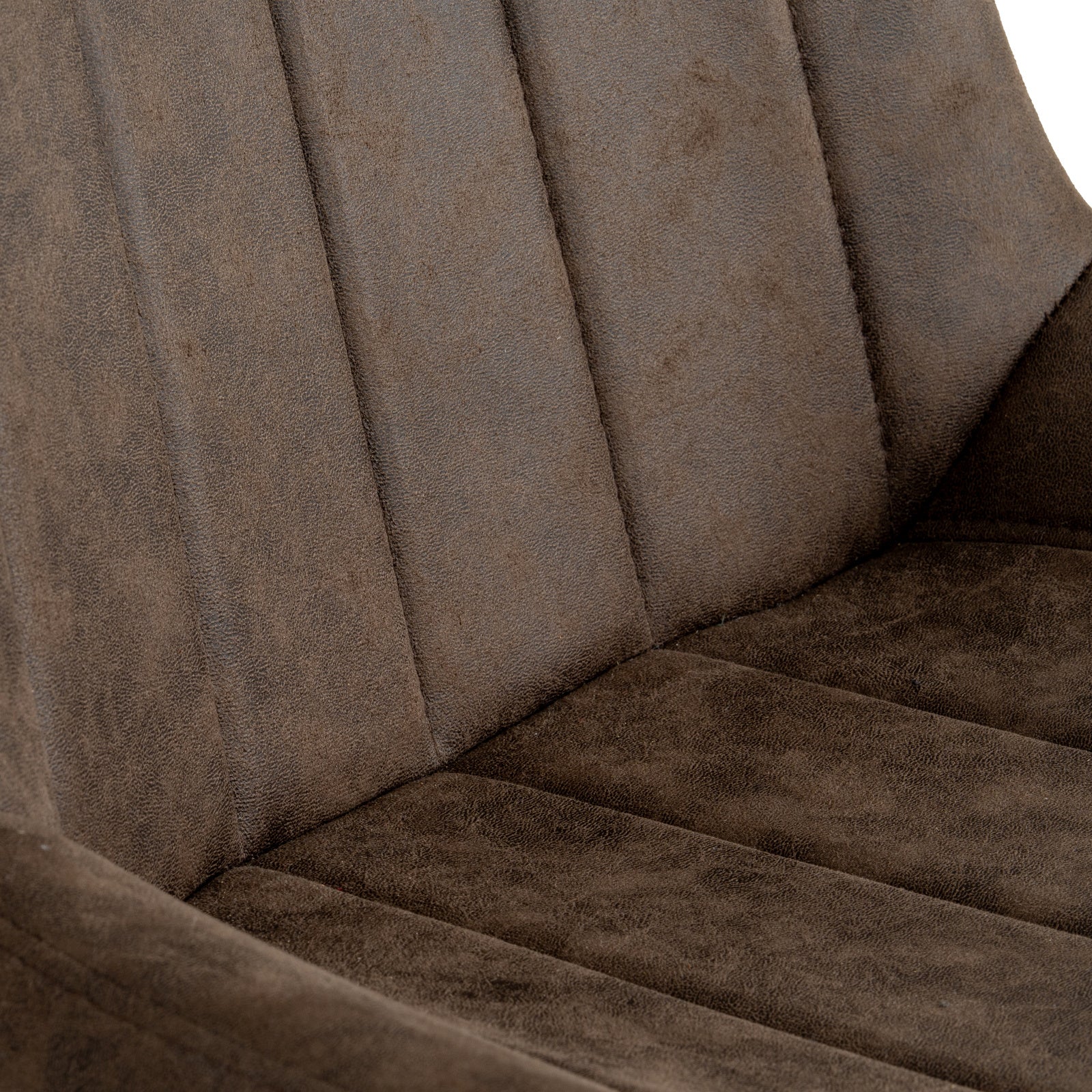 Close-up view of the vertical channel-stitched backrest in dark coffee faux leather on the Malmo swivel chair