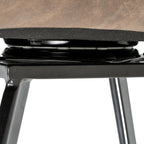 Detail shot showing the heavy-duty metal swivel plate mechanism beneath the Malmo dining chair seat