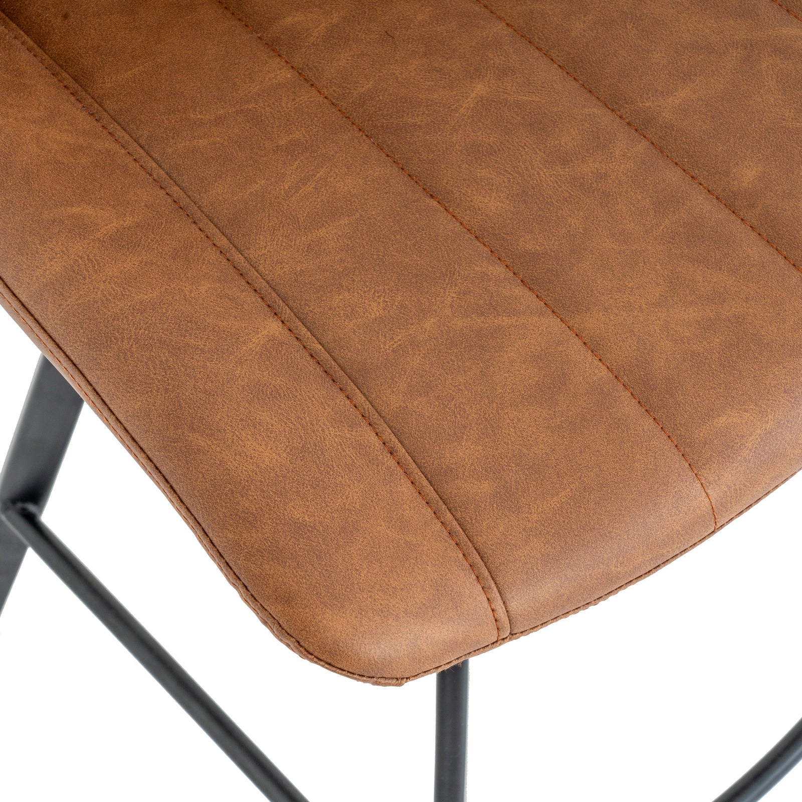 Close-up view of the vertical channel stitching and warm tan faux leather upholstery on the Malmo swivel bar stool seat