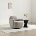 Micky 360 swivel armchair in light mist fabric set in an elegant home interior   