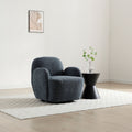Micky swivel armchair in navy blue textured fabric styled in a contemporary living room   