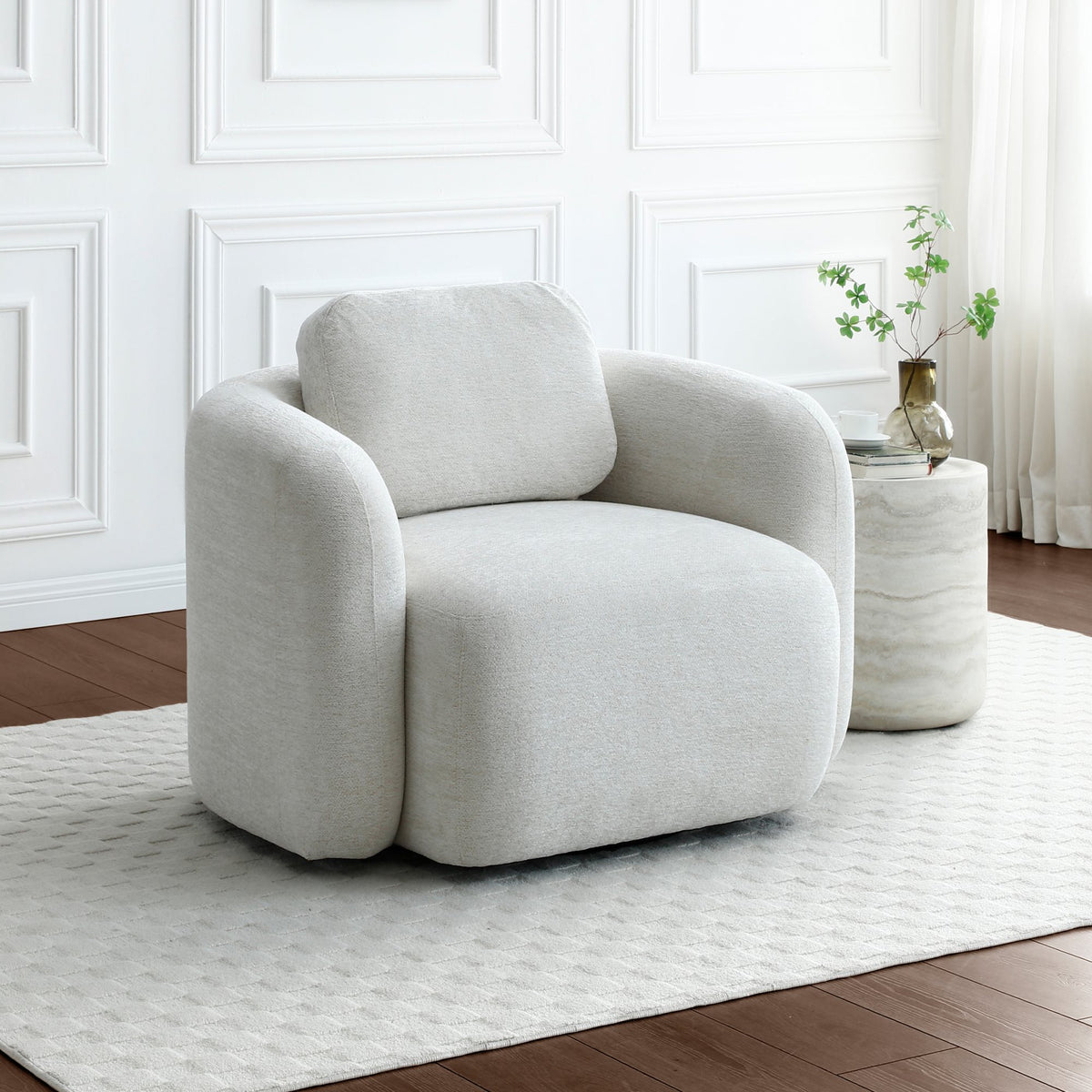 Mitch 360 swivel armchair in light mist fabric set in a bright modern home interior   