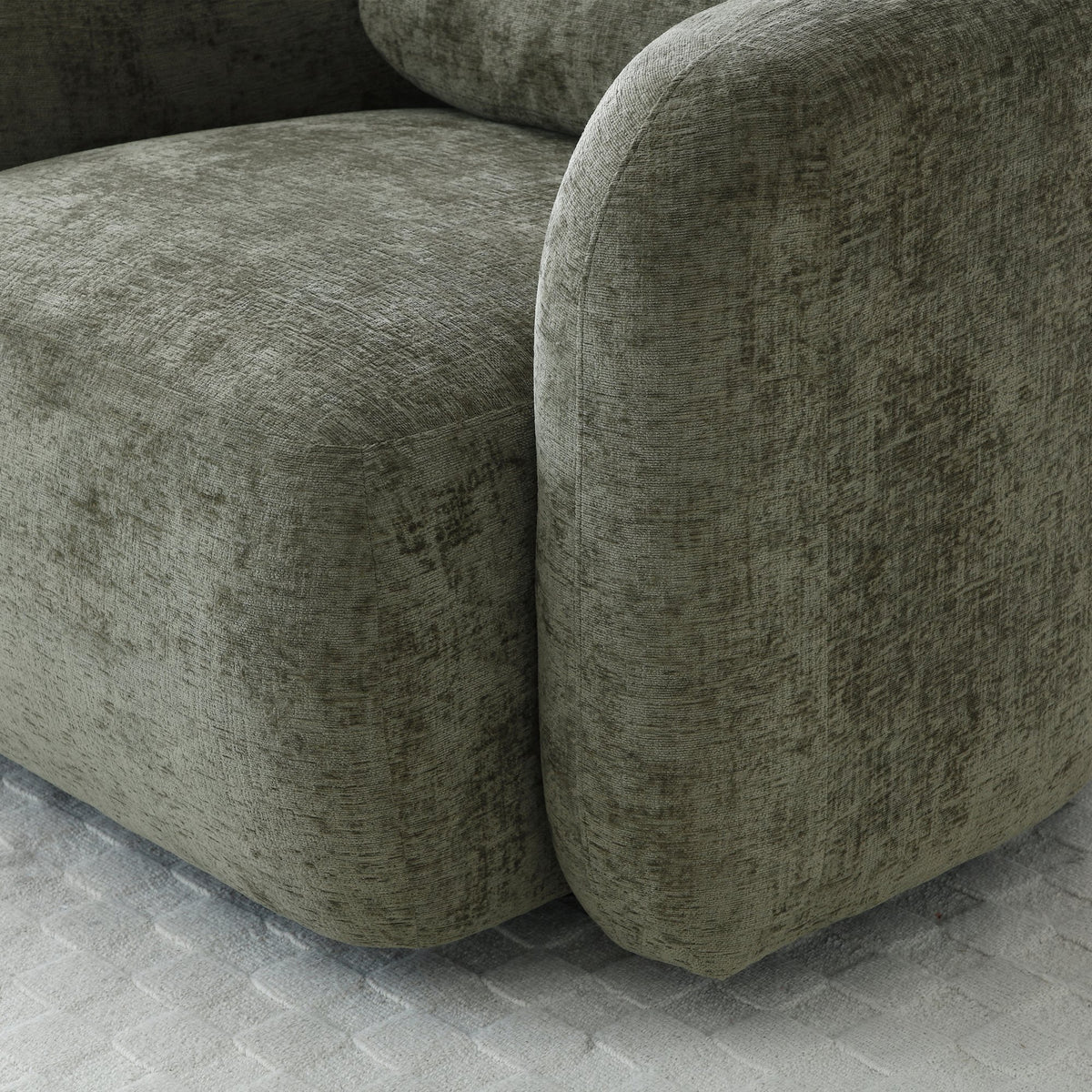 Close-up shot of the soft textured olive green fabric upholstery on the Mitch swivel chair   