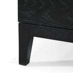 Close-up of a Orchid 3-drawer chest furniture piece showing front tapered leg 