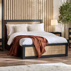 Padstow black oak ottoman bed with lift-up storage styled in a bedroom