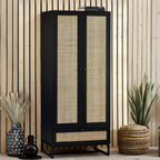 Padstow black oak 2 door rattan wardrobe styled in a modern bedroom setting with neutral accents