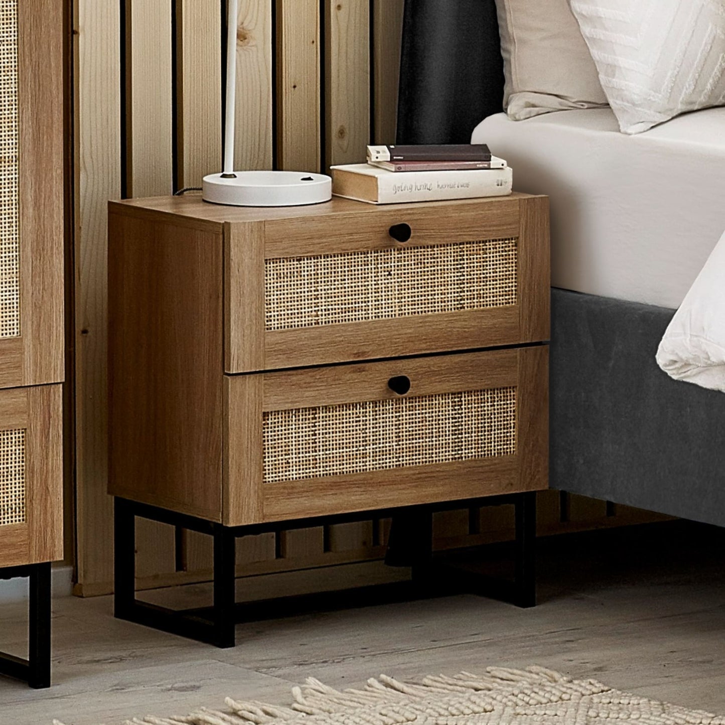 Padstow natural oak 2 drawer rattan bedside table styled with lamp beside bed