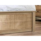 Detailed shot of the woven cane inlay on the natural oak footboard