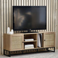 Padstow natural oak rattan TV unit styled with television and gaming console in living room