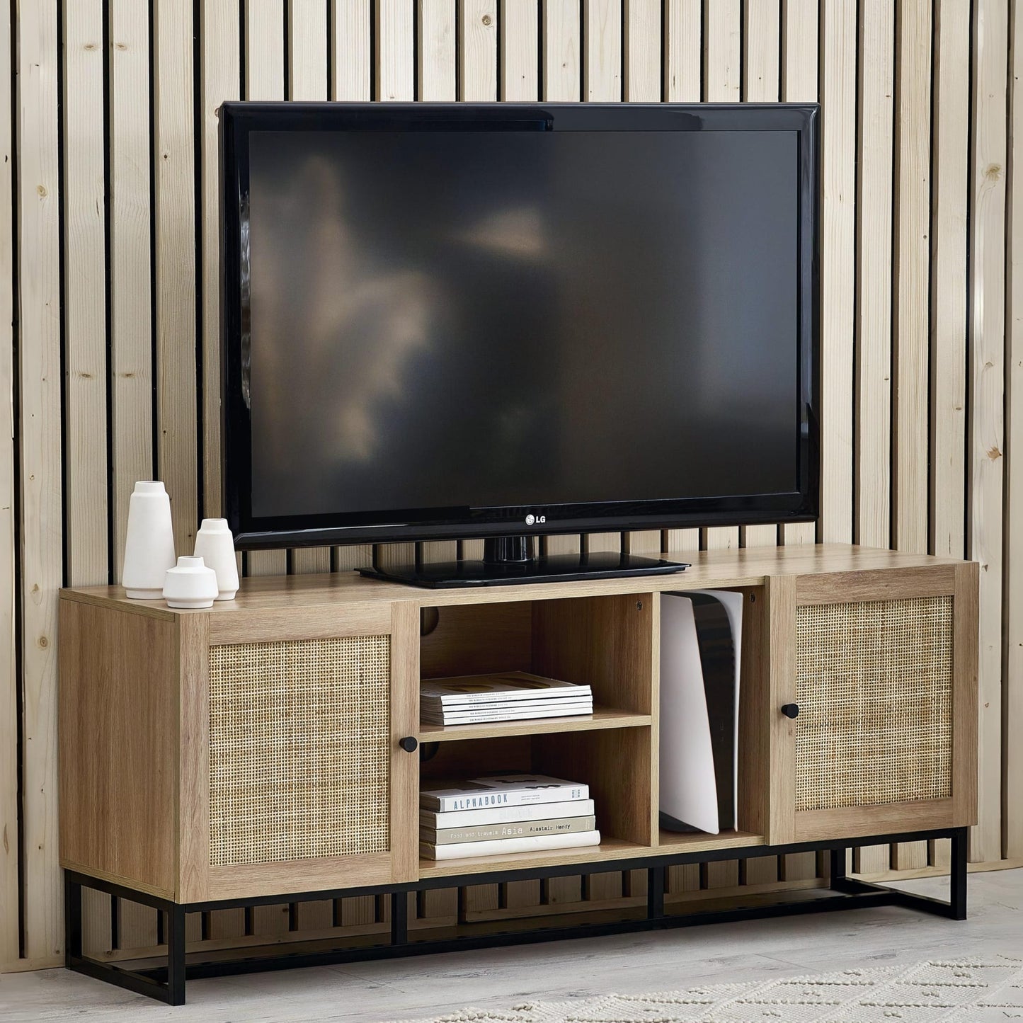 Padstow natural oak rattan TV unit styled with television and gaming console in living room