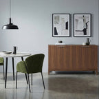 Lifestyle image featuring the Peony 2-door sideboard in walnut finish styled with dining chairs and subtle home decor in a bright room.