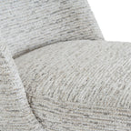 Close-up shot of the multi-tonal textured bouclé fabric weave on the seat cushion of the Sorelle chair