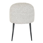 Rear view displaying the curved back silhouette and black metal leg frame on the Sorelle dining chair