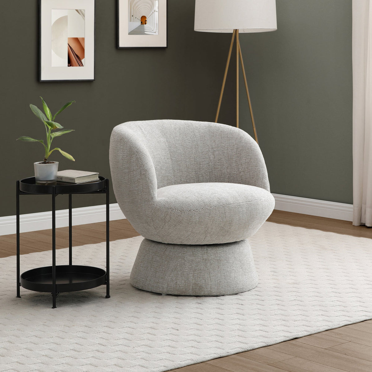 Light neutral grey Tulip swivel accent chair styled in an elegant home interior   