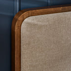 Close-up shot of the rounded solid hardwood corner frame and textured chenille fabric inlay on the Walden bed headboard