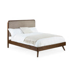 Perspective view displaying the Walden wooden bed frame dressed with white bedding and a cream throw blanket
