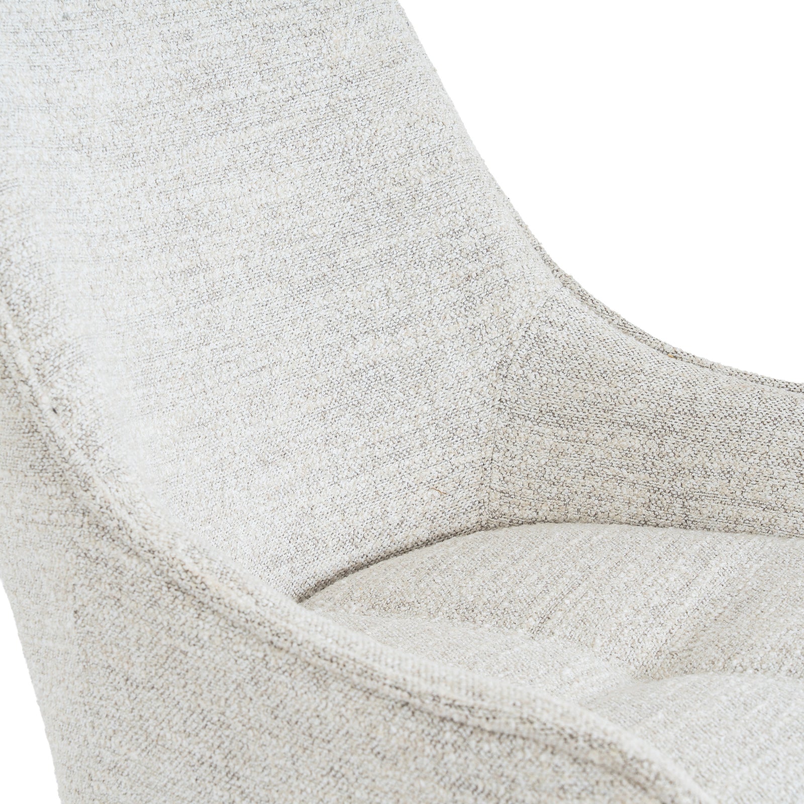 Close-up detail of the woven neutral fabric texture and swooped armrest on the Zephra Chair.