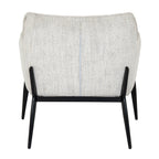 Rear view showing the architectural black frame cradling the neutral upholstered shell of the Zephra Chair.