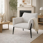 Zephra Upholstered Accent Chair styled in a modern living room setting with a side table and throw blanket.