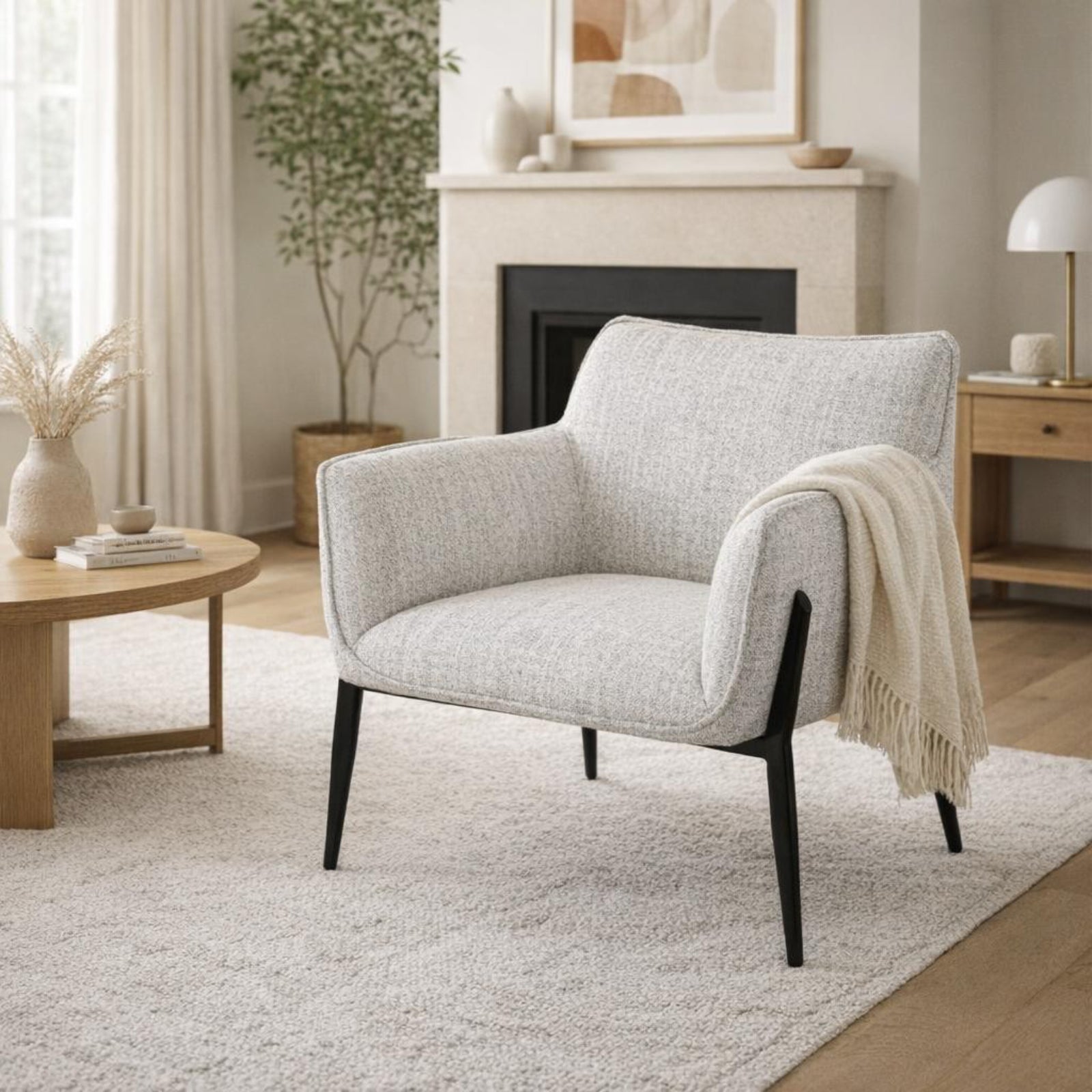 Zephra Upholstered Accent Chair styled in a modern living room setting with a side table and throw blanket.